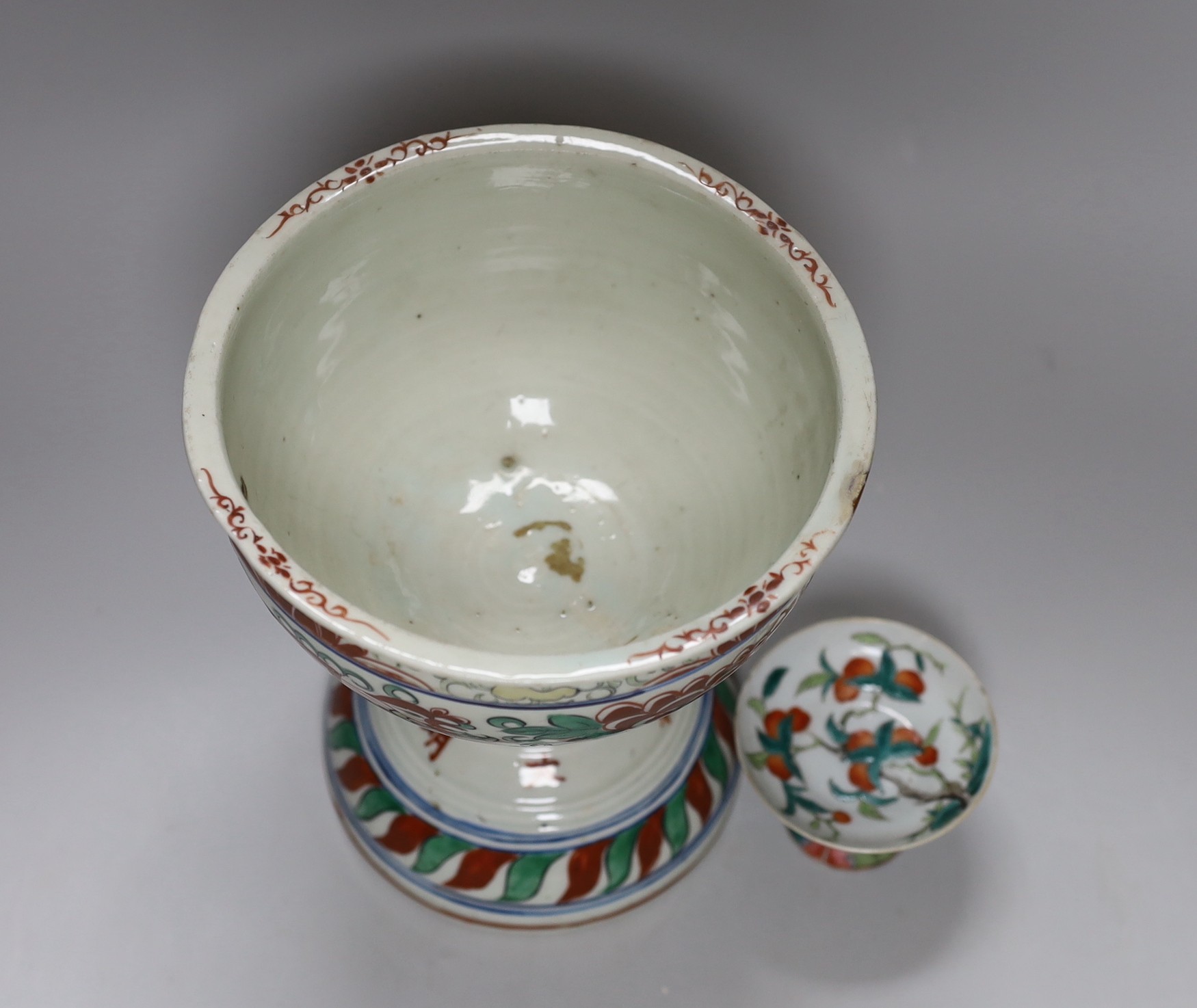 A small 19th Chinese stem dish decorated with peaches and a late 20th century large Wucai stem cup, 18.5cm